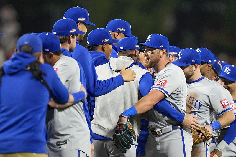 AP photo by Stephanie Scarbrough / Kansas City Royals outfielder Hunter Renfroe, center, celebrates with teammates after their 2-1 playoff win against the host Baltimore Orioles on Wednesday night.