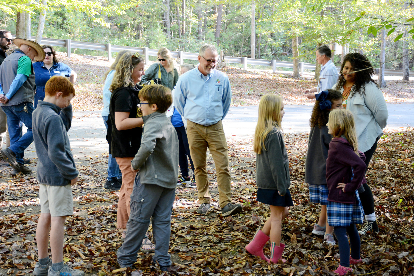 Staff Photo by Robin Rudd / Bill Avant, senior real property manager for the state of Tennessee, center, talks Oct. 8, 2024, with students from Skillern Elementary at Ivy Academy at a Cumberland Trail access point on Leggett Road in Sale Creek. A land swap between the state and the Chattanooga Audubon Society will allow for portions of the Cumberland Trail to connect through an undeveloped portion of McDonald Farm.