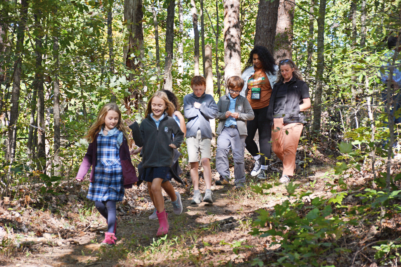 Staff Photo by Robin Rudd / Students and staff from Skillern Elementary at Ivy Academy walk Oct. 8, 2024, along a trail atop Audubon Mountain, near Sale Creek. A land swap between the state and the Chattanooga Audubon Society will allow for portions of the Cumberland Trail to connect through an undeveloped portion of McDonald Farm.