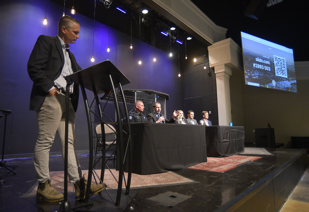 Staff photo by Matt Hamilton / Jonathan Ingraham, left, leads a panel discussion with, from left, Chattanooga Police Chief Jonathan Chambers, Hamilton County Superintendent Justin Robertson, District Attorney Coty Wamp, Hamilton County Mayor Weston Wamp and Chattanooga Mayor Tim Kelly on Tuesday, Oct. 8, 2024.
