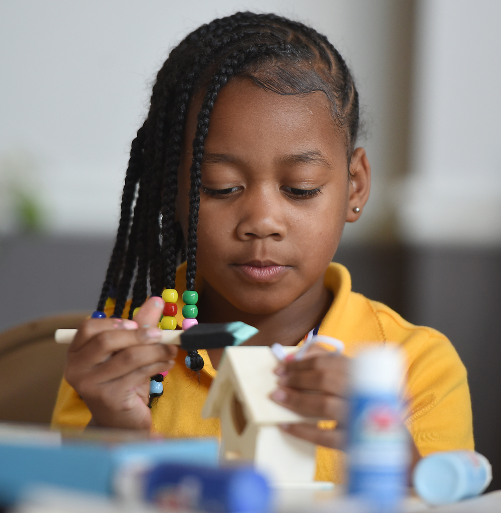 Staff photo by Matt Hamilton / Serenity Slater, 7, paints a birdhouse Oct. 22, 2024, during a lesson about constellations and birds at Girls Inc. of Chattanooga.