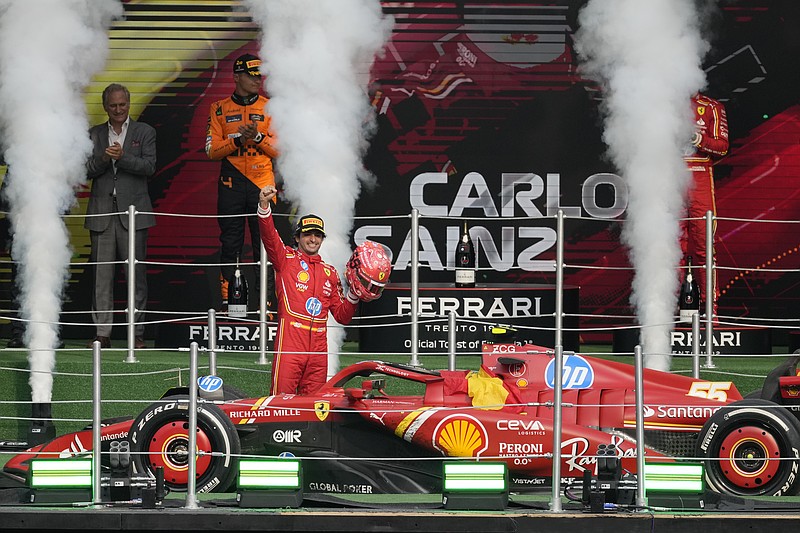 AP photo by Eduardo Verdugo / Ferrari driver Carlos Sainz celebrates after winning Formula One's Mexico City GP on Sunday.