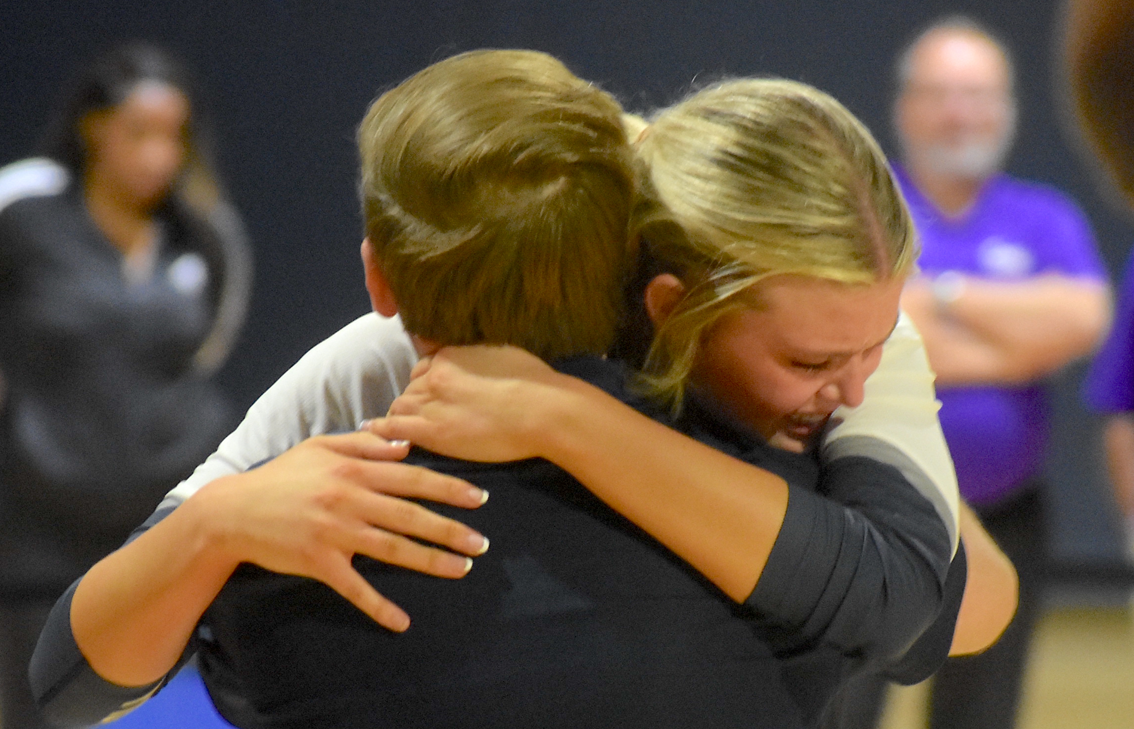 Staff photo by Patrick MacCoon / Gordon Lee volleyball head coach Nic Hann and senior Ava Carswell embrace after the Lady Trojans season concluded with a record-setting 41 wins in the GHSA Class A state championship. Elite Scholars Academy won the state title with a 3-0 win at LakePoint Sports in Emerson, Ga.