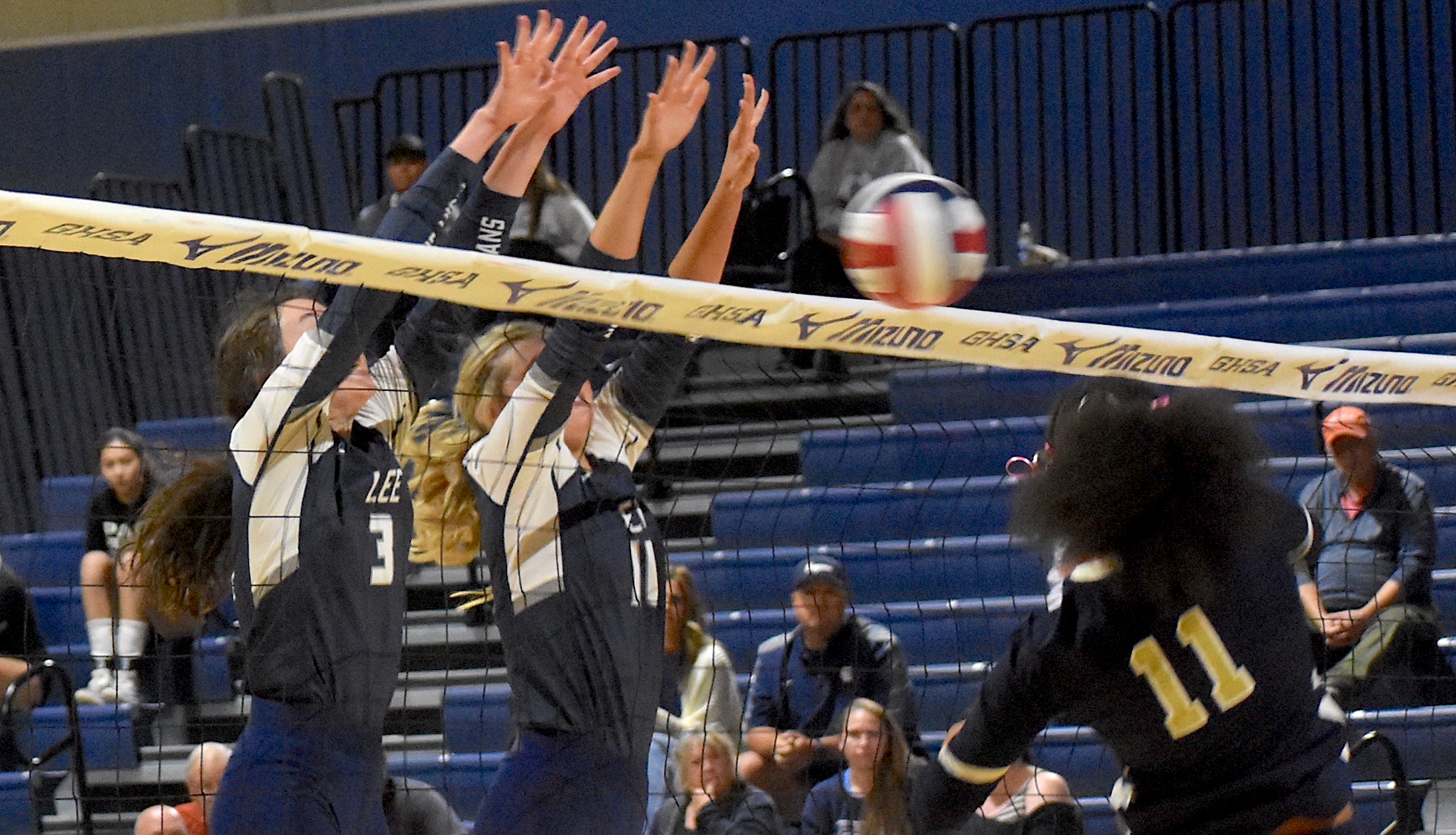 Staff photo by Patrick MacCoon / A pair of Gordon Lee blockers go up to try and stop a hit from Elite Scholars Academy in Monday's GHSA Class A state championship game at LakePoint Sports in Emerson, Ga.