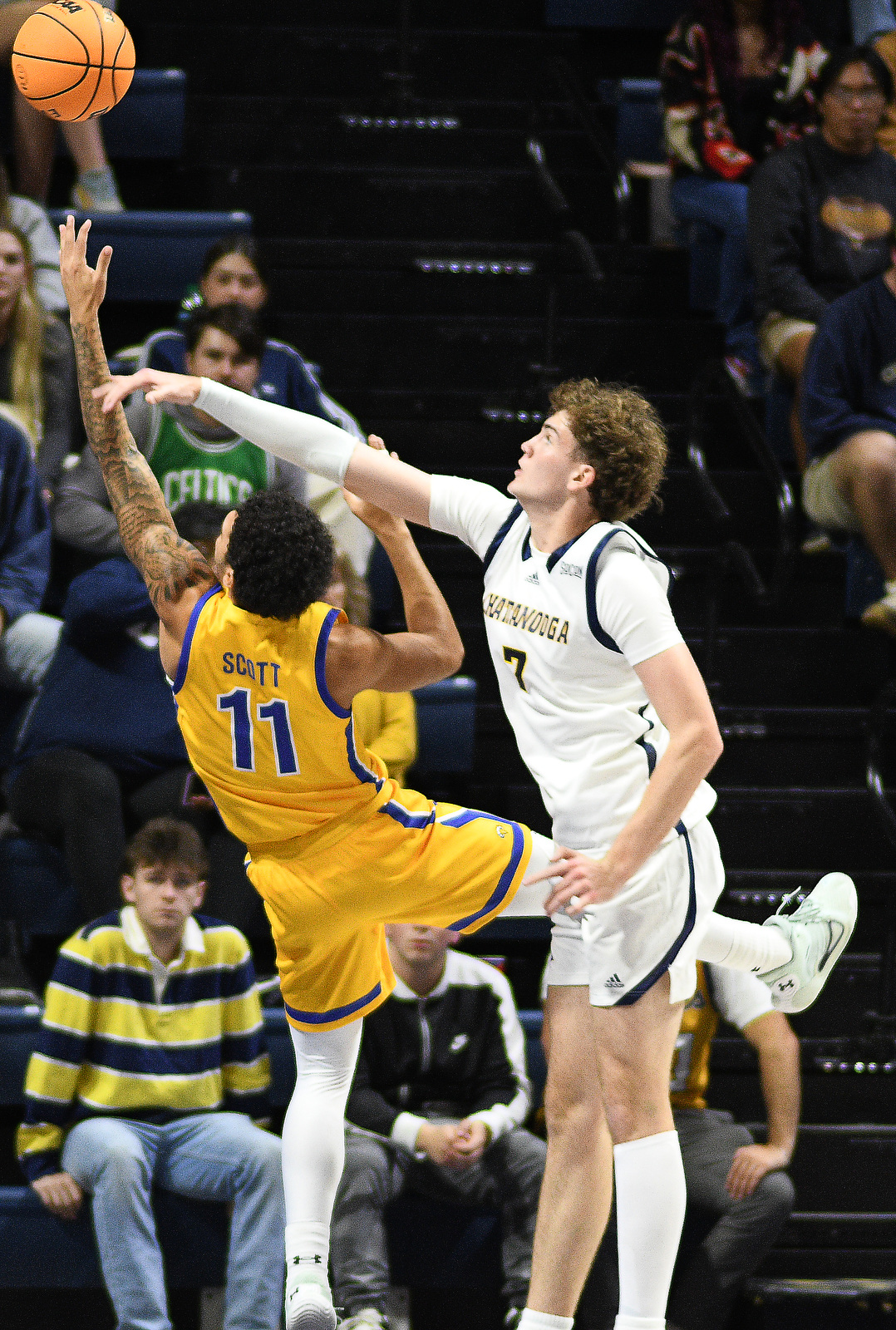 Staff Photo by Robin Rudd / Morehead's Trent Scott (11) gets by UTC's Sean Cusano (7). The University of Tennessee at Chattanooga Mocs hosted the Morehead State University Eagles in a men's basketball game on November 14, 2024.