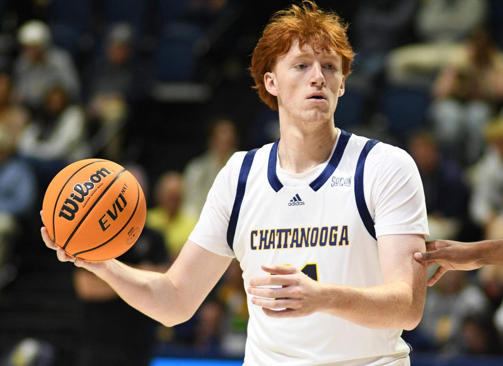 Staff Photo by Robin Rudd / UTC's Collin Mullholland (21) looks for an open teammate. The University of Tennessee at Chattanooga Mocs hosted the Morehead State University Eagles in a men's basketball game on November 14, 2024.