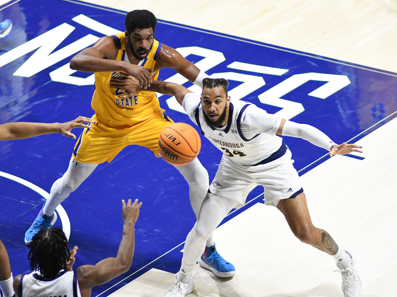 Staff Photo by Robin Rudd / UTC's Trey Bonham (2) passes to Latin Diouf (23). The University of Tennessee at Chattanooga Mocs hosted the Morehead State University Eagles in a men's basketball game on November 14, 2024.