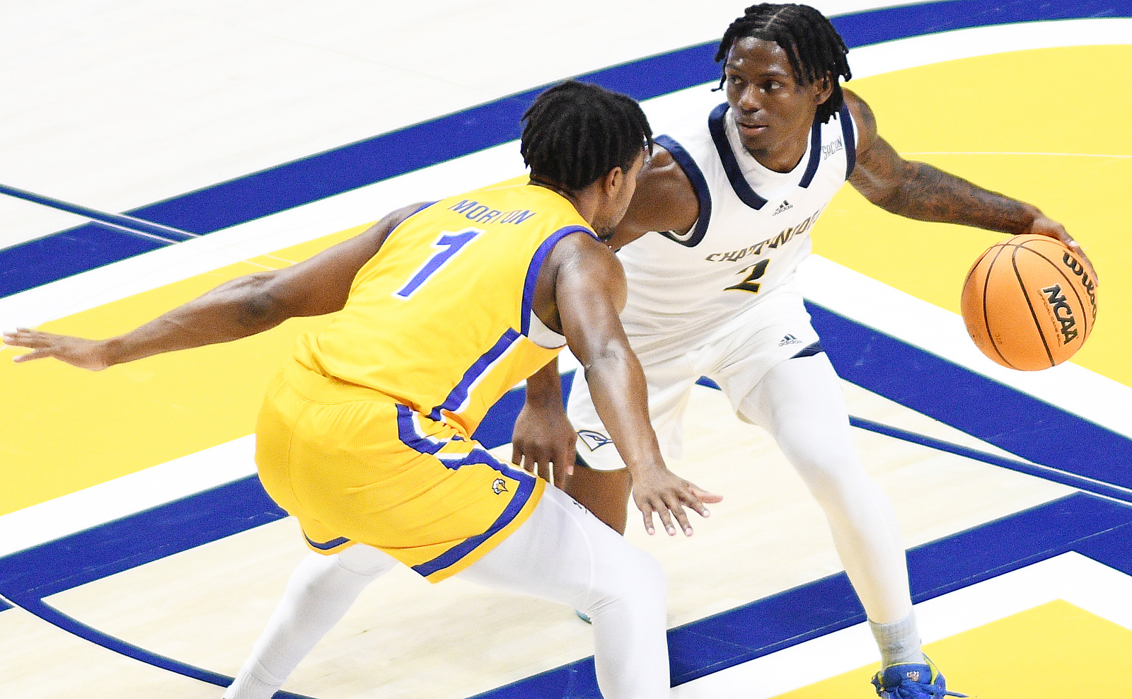 Staff Photo by Robin Rudd / UTC's Trey Bonham (2) sets the offense as Morehead's Jerome Morton (1) defends. The University of Tennessee at Chattanooga Mocs hosted the Morehead State University Eagles in a men's basketball game on November 14, 2024.