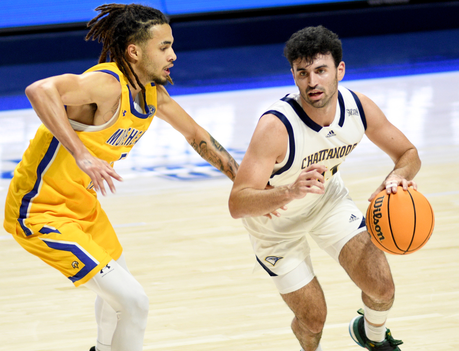 Staff Photo by Robin Rudd / UTC's Jack Kostel (11) dribbles around a defender. The University of Tennessee at Chattanooga Mocs hosted the Morehead State University Eagles in a men's basketball game on November 14, 2024.