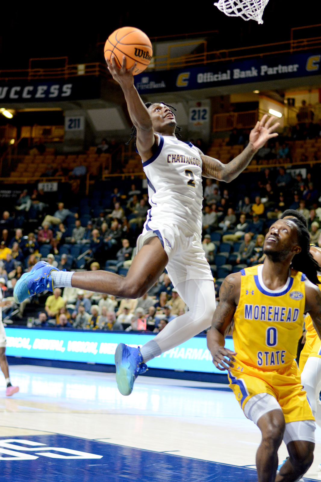 Staff Photo by Robin Rudd / UTC's Trey Bonham (2) scores from under the basket. The University of Tennessee at Chattanooga Mocs hosted the Morehead State University Eagles in a men's basketball game on November 14, 2024.