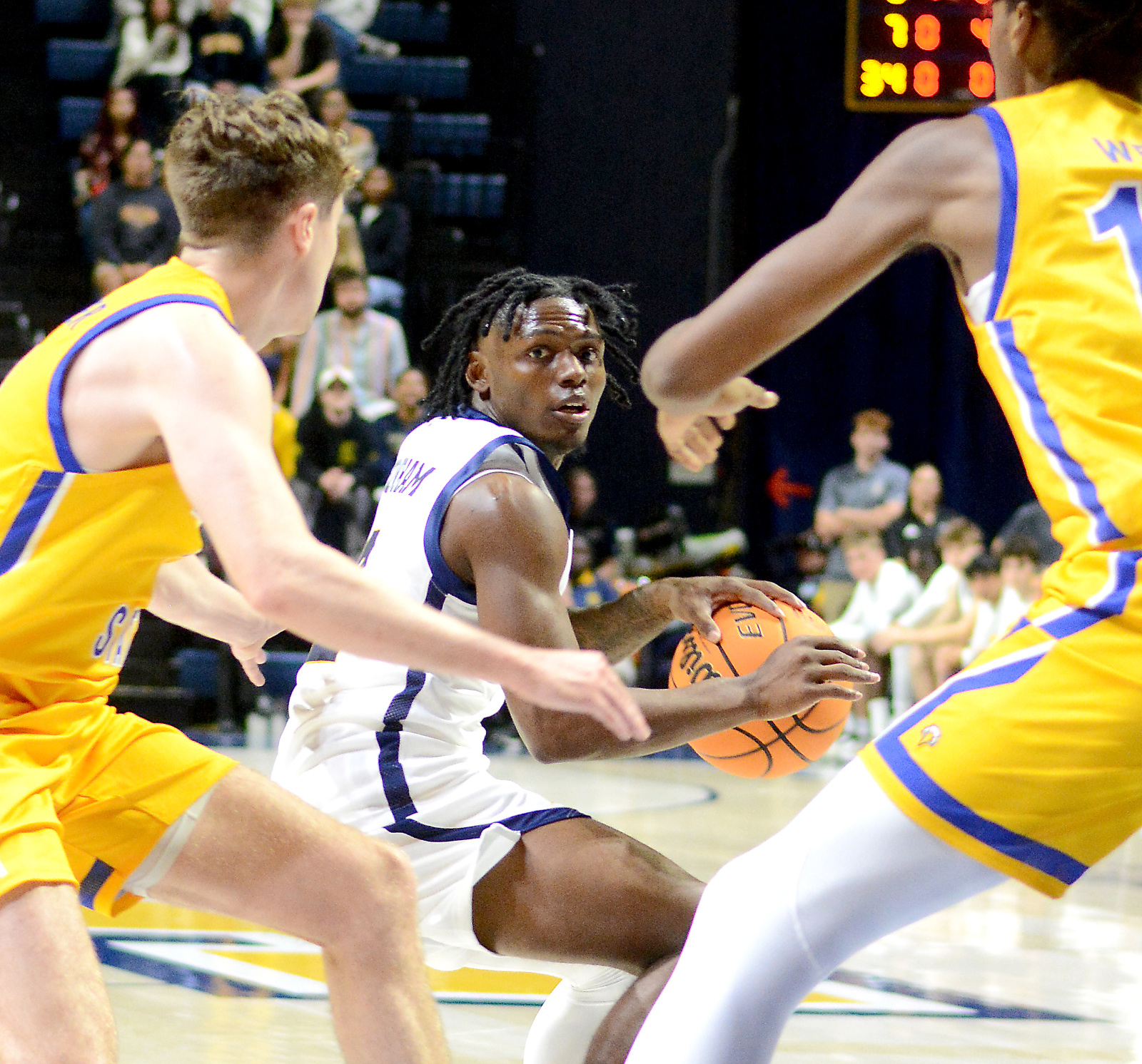 Staff Photo by Robin Rudd / UTC's Trey Bonham looks into the Eagle defense. The University of Tennessee at Chattanooga Mocs hosted the Morehead State University Eagles in a men's basketball game on November 14, 2024.
