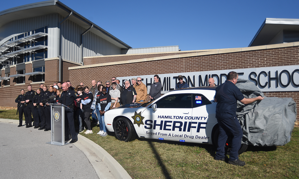 Staff photo by Matt Hamilton / Hamilton County Sheriff Austin Garrett speaks Nov. 21, 2024, as a new DARE vehicle is unveiled at East Hamilton Middle School. The car's new paint job includes the phrase
