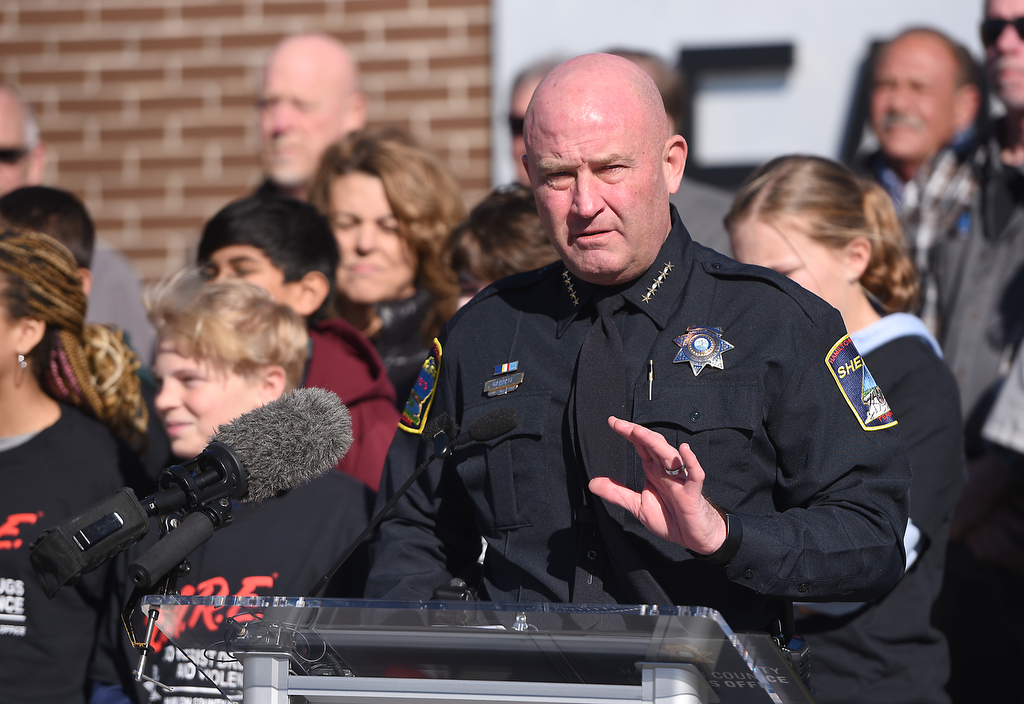 Staff photo by Matt Hamilton / Hamilton County Sheriff Austin Garrett speaks Nov. 21, 2024, as a new DARE vehicle is unveiled at East Hamilton Middle School.