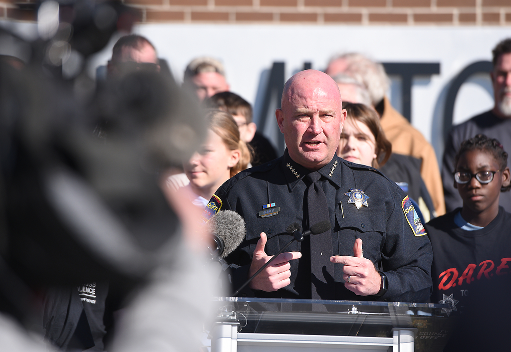 Staff photo by Matt Hamilton / Hamilton County Sheriff Austin Garrett speaks Nov. 21, 2024, as a new DARE vehicle is unveiled at East Hamilton Middle School.