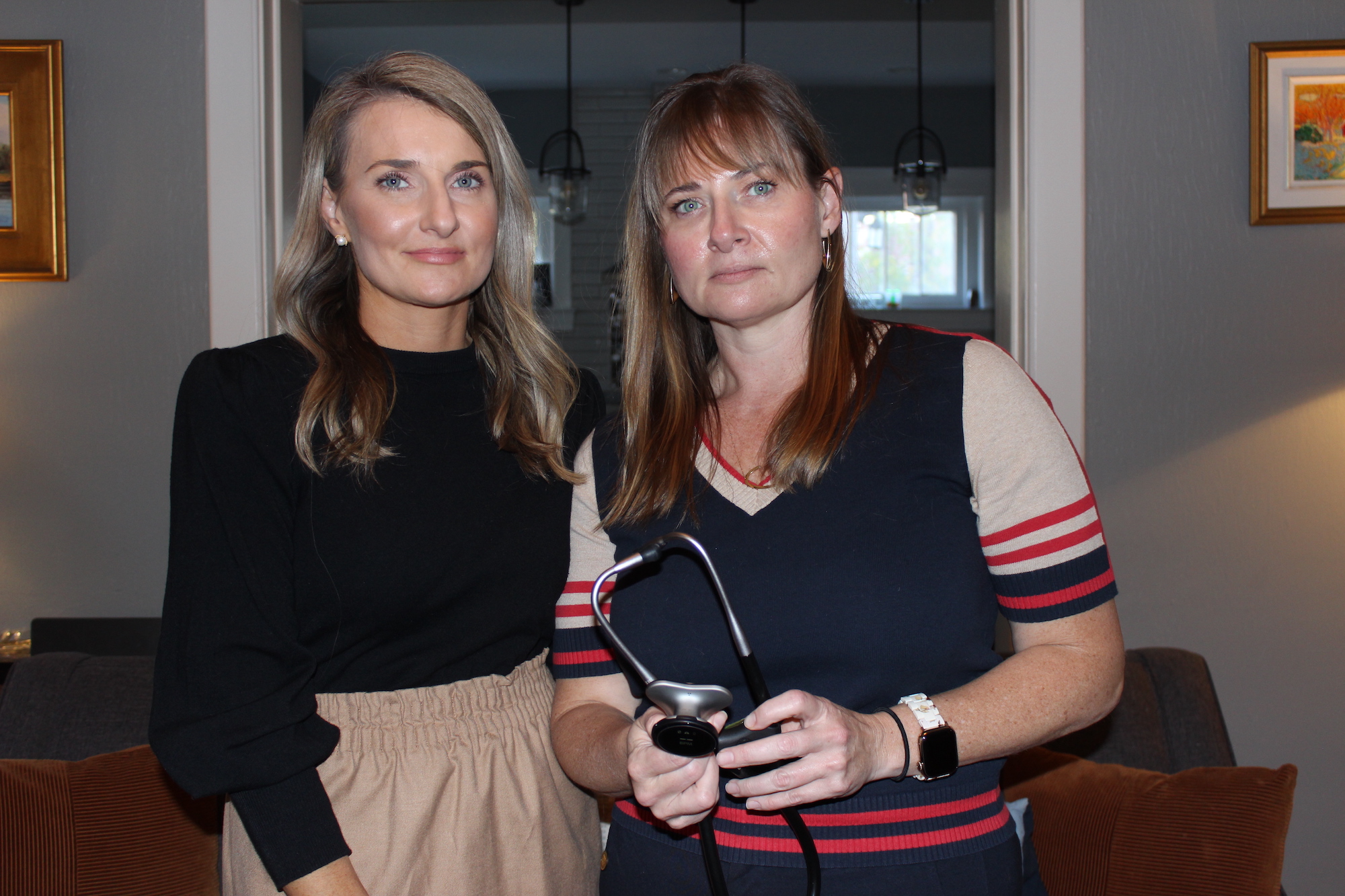 Anna Maki Cowley and Alexandra Maki, the daughters of Anton Maki Jr., have filed complaints with the Tennessee and federal governments about the care that Anton Maki received at Ballad Health's Holston Valley Medical Center earlier this year. Alexandra Maki, a surgeon in Kentucky, is shown with her late father's stethoscope. (Brett Kelman/KFF Health News)