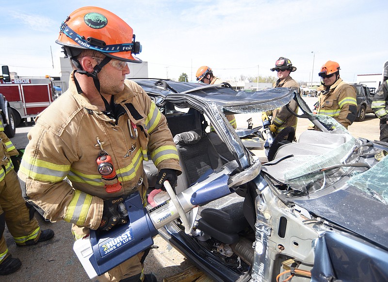 Staff file photo by Matt Hamilton / A Chattanooga firefighter cuts through the body of a crashed van in 2023 during a regional extraction class at the Police and Fire Training Center. A former Chattanooga firefighter is in the midst of a legal battle over his disability benefits.