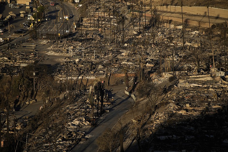 Photo/John Locher/The Associated Press / The Palisades Fire leaves total devastation in the Pacific Palisades neighborhood of Los Angeles on Monday, Jan. 13, 2025.