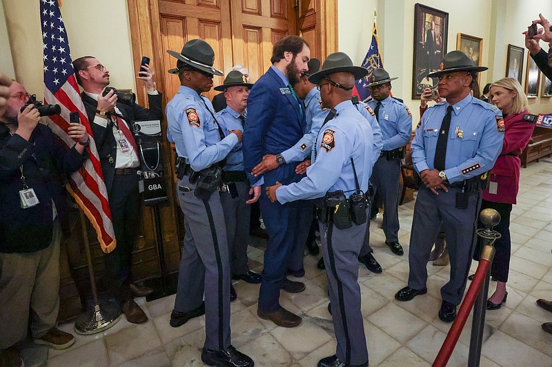 Sen. Colton Moore, R-Trenton, is detained by Georgia State Patrol as Moore attempted to enter the state House of Representatives for the state of the state address at the Georgia Capitol on Thursday, Jan. 16, 2025, in Atlanta. Moore was banned from the House last year after comments he made about the late House Speaker David Ralston. (Jason Getz / AJC)