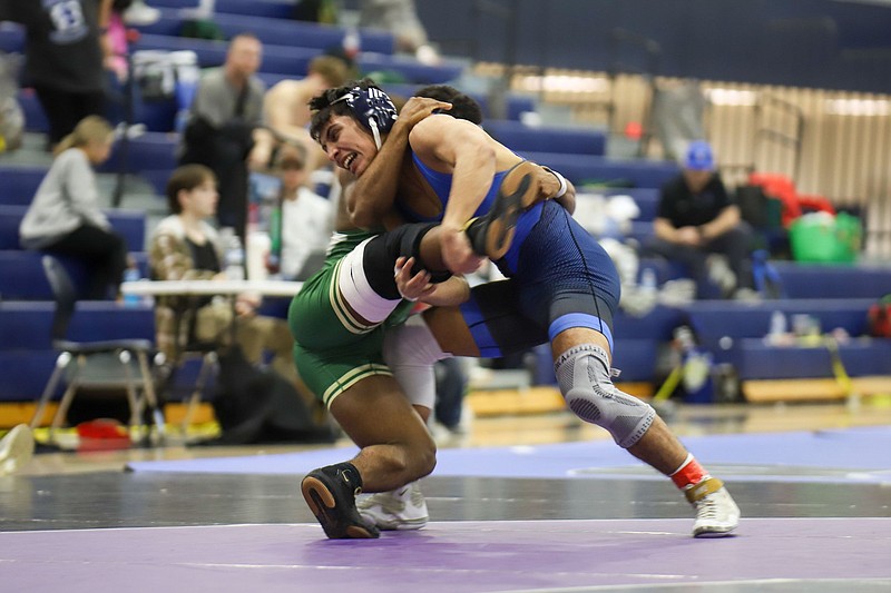 Staff file photo / Ringgold wrestler Jaxon Delgado, right, is part of a formidable middle of the lineup for the Tigers heading into the GHSA Class AA state duals Friday at Columbus High School.