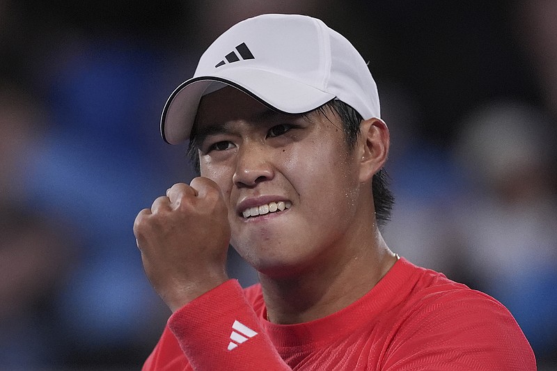 AP photo by Ng Han Guan / Learner Tien celebrates during his second-round match against Daniil Medvedev at the Australian Open early Friday in Melbourne.