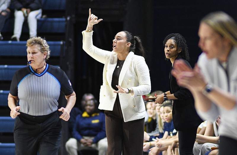 Staff Photo by Robin Rudd / UTC women's basketball coach Desandra Schirmer signals to her team during Thursday night's SoCon game against Samford at McKenzie Arena.