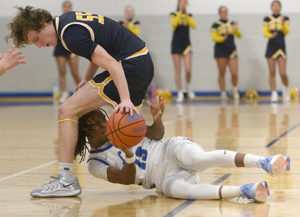 Staff photo by Matt Hamilton/ Red Bank (13) Micah Allen tries to pass after winning the ball against Walker Valley (55) Graham Campbell during their game at Red Bank High School on Tuesday, January 21, 2025.