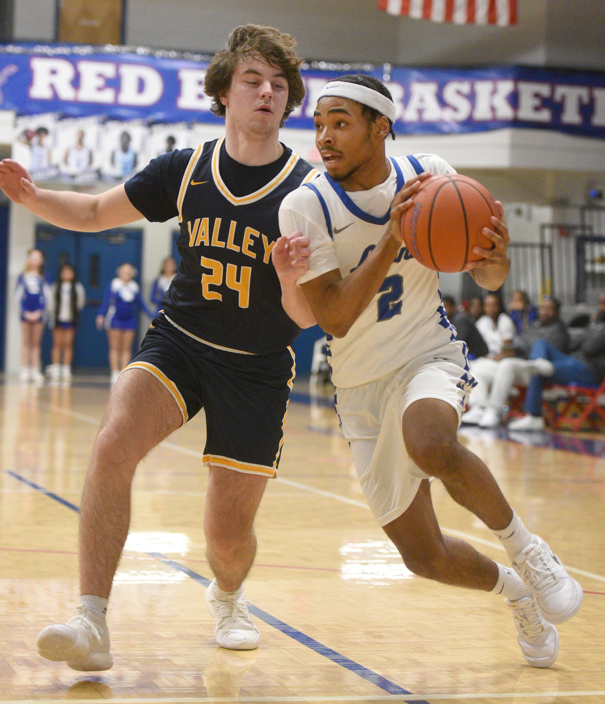 Staff photo by Matt Hamilton/ Red Bank (2) Kobey Jones drives to the hoop as Walker Valley (24) Landon Shirk defends during their game at Red Bank High School on Tuesday, January 21, 2025.
