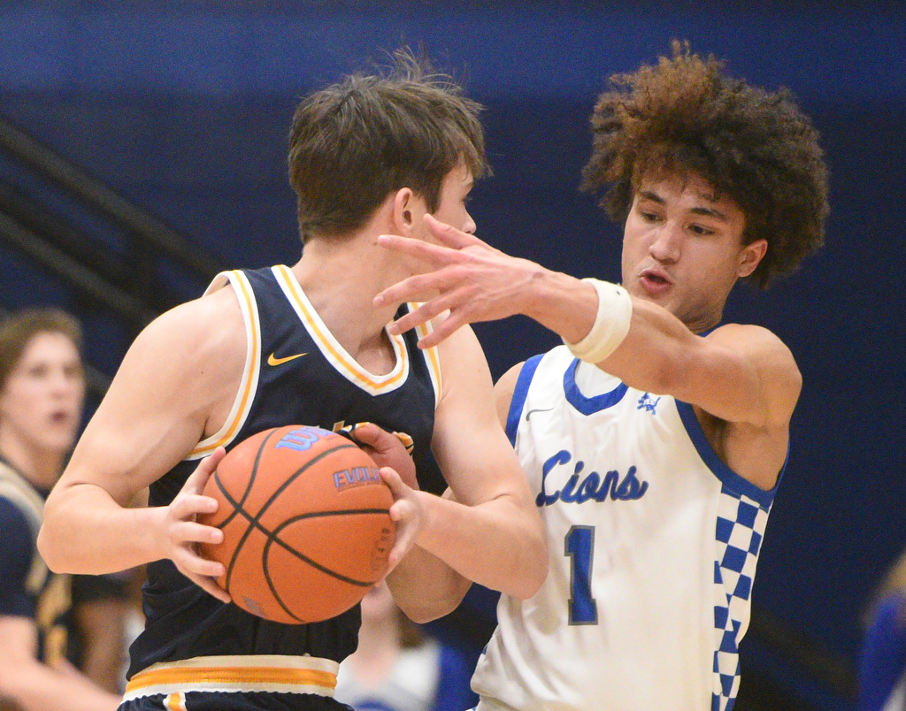 Staff photo by Matt Hamilton/ Red Bank (1) Drayden Collier defends as Walker Valley (20) Isaac Sausville looks for an outlet during their game at Red Bank High School on Tuesday, January 21, 2025.
