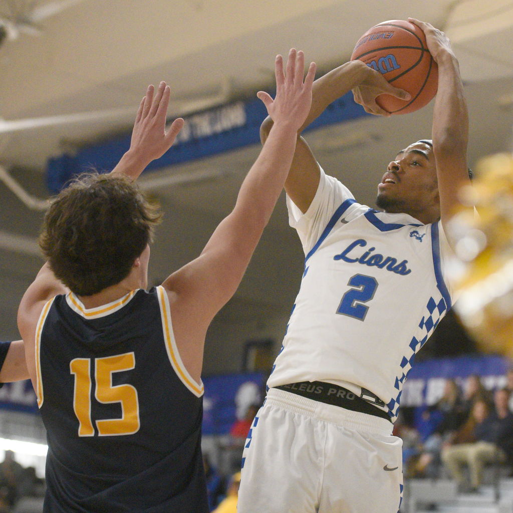 Staff photo by Matt Hamilton/ Red Bank (2) Kobey Jones puts up a shot as Walker Valley (15) Cael Coates defends during their game at Red Bank High School on Tuesday, January 21, 2025.