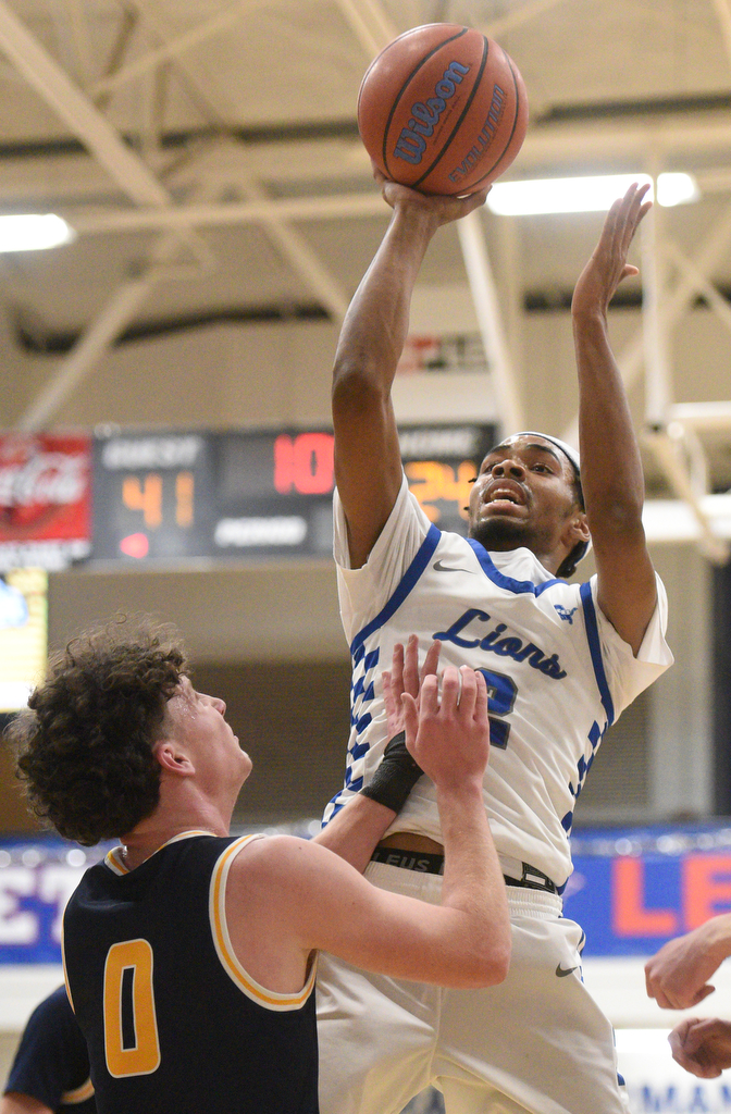 Staff photo by Matt Hamilton/ Red Bank (2) Kobey Jones puts up a shot as Walker Valley (0) Tucker Campbell defends during their game at Red Bank High School on Tuesday, January 21, 2025.