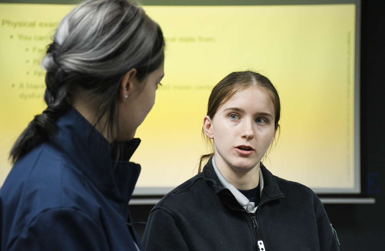 Staff Photo by Robin Rudd / From left, Abigail Christensen listens Jan. 22, 2025, as Maggie Nunley talks about the program. Starting this school year, Hixson High students can receive hands-on training at Hamilton County's EMS Training Center.