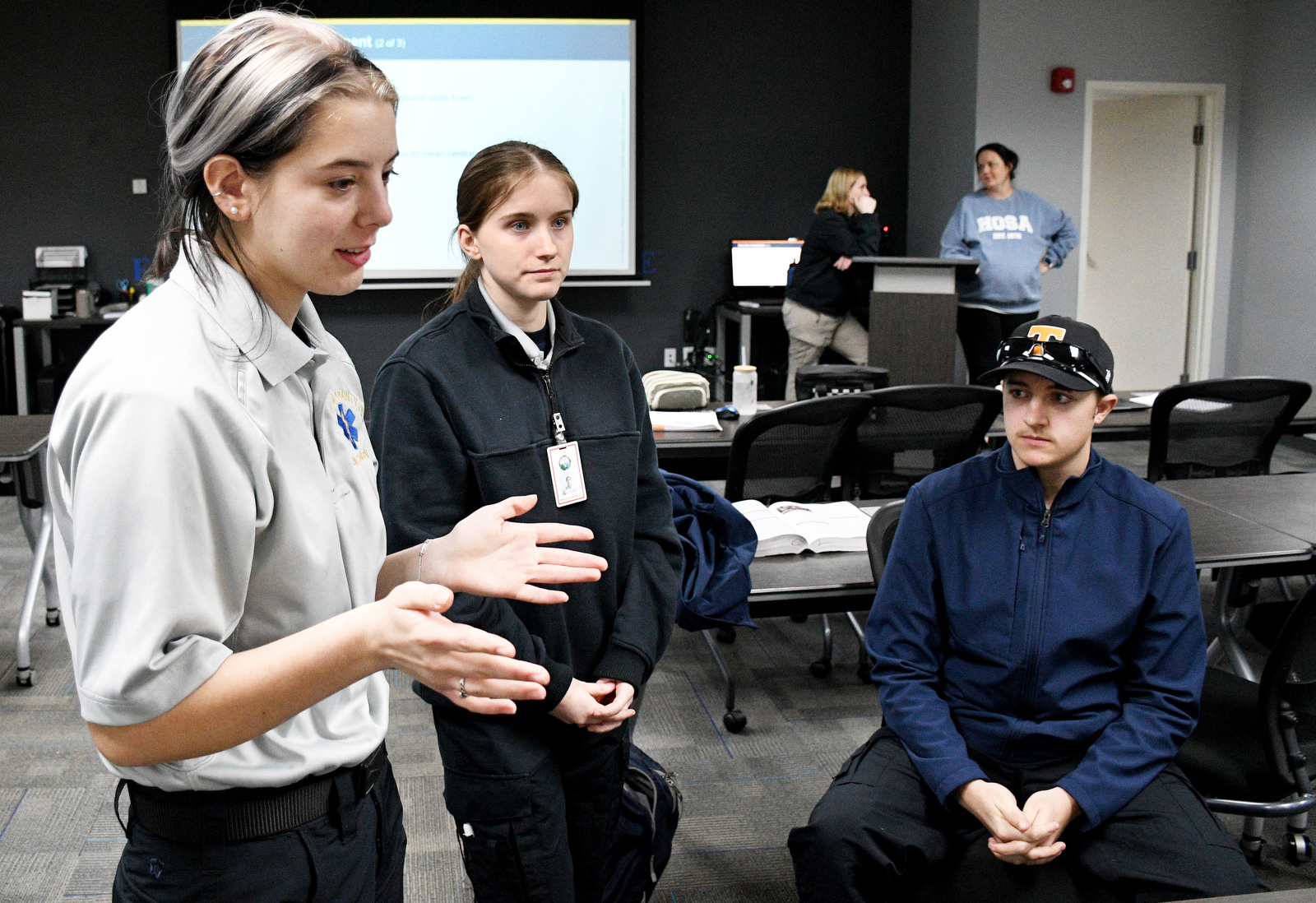 Staff Photo by Robin Rudd / From left, Abigail Christensen talks about the program Jan. 22, 2025, as Maggie Nunley and Bradley Dowlen listen. Starting this school year, Hixson High students can receive hands-on training at Hamilton County's EMS Training Center.