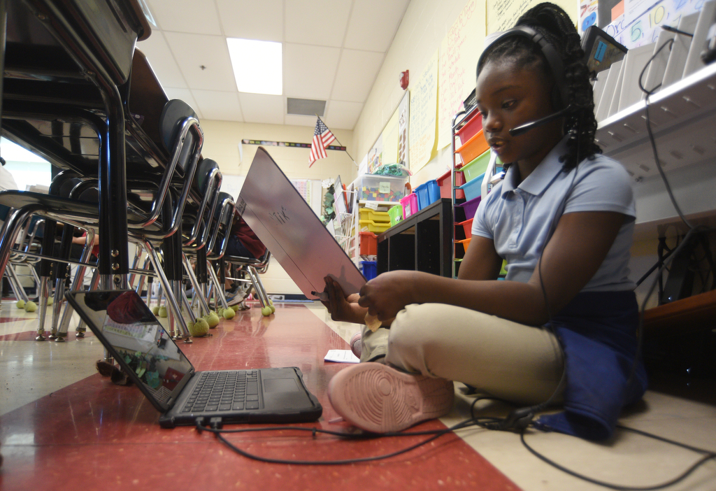 Staff photo by Matt Hamilton/ Concepion Watkin works with a tutor via video chat during a class at Orchard Knob Elementary School on Tuesday, March 11, 2025.