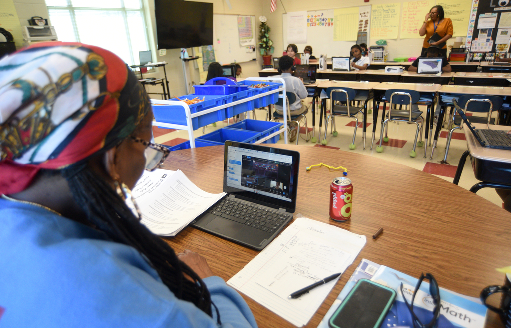 Staff photo by Matt Hamilton/ Sonia Thornton, a third-grade math and science teacher, monitors tutoring sessions during a class at Orchard Knob Elementary School on Tuesday, March 11, 2025.