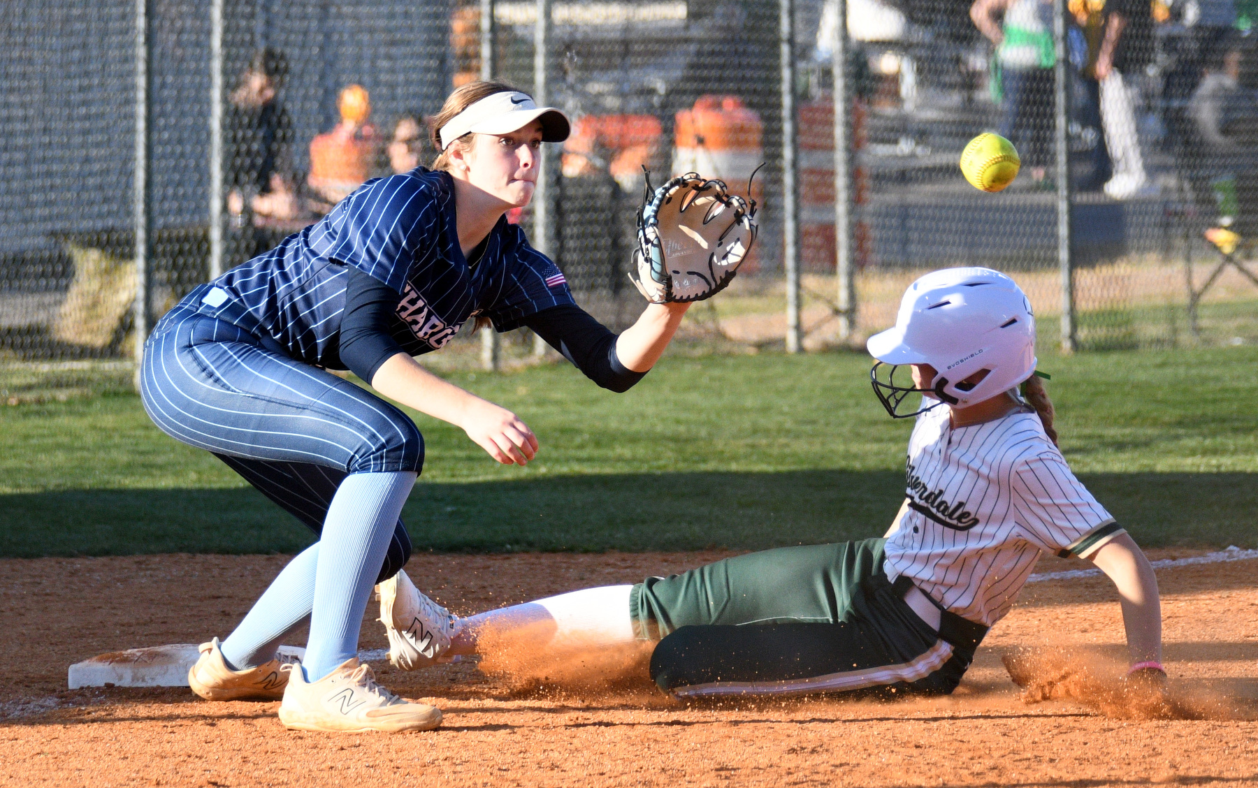 Staff Photo by Robin Rudd / Silverdale's Heidi Bryant (11) is safe at third as Chattanooga Christian's Millie Fox (3) takes the throw. Bryant advanced on teammate Allie Weber's sacrifice bunt. The Chattanooga Christian Chargers hosted the Silverdale Academy Seahawks in a TSSAA softball game on March 11, 2025.