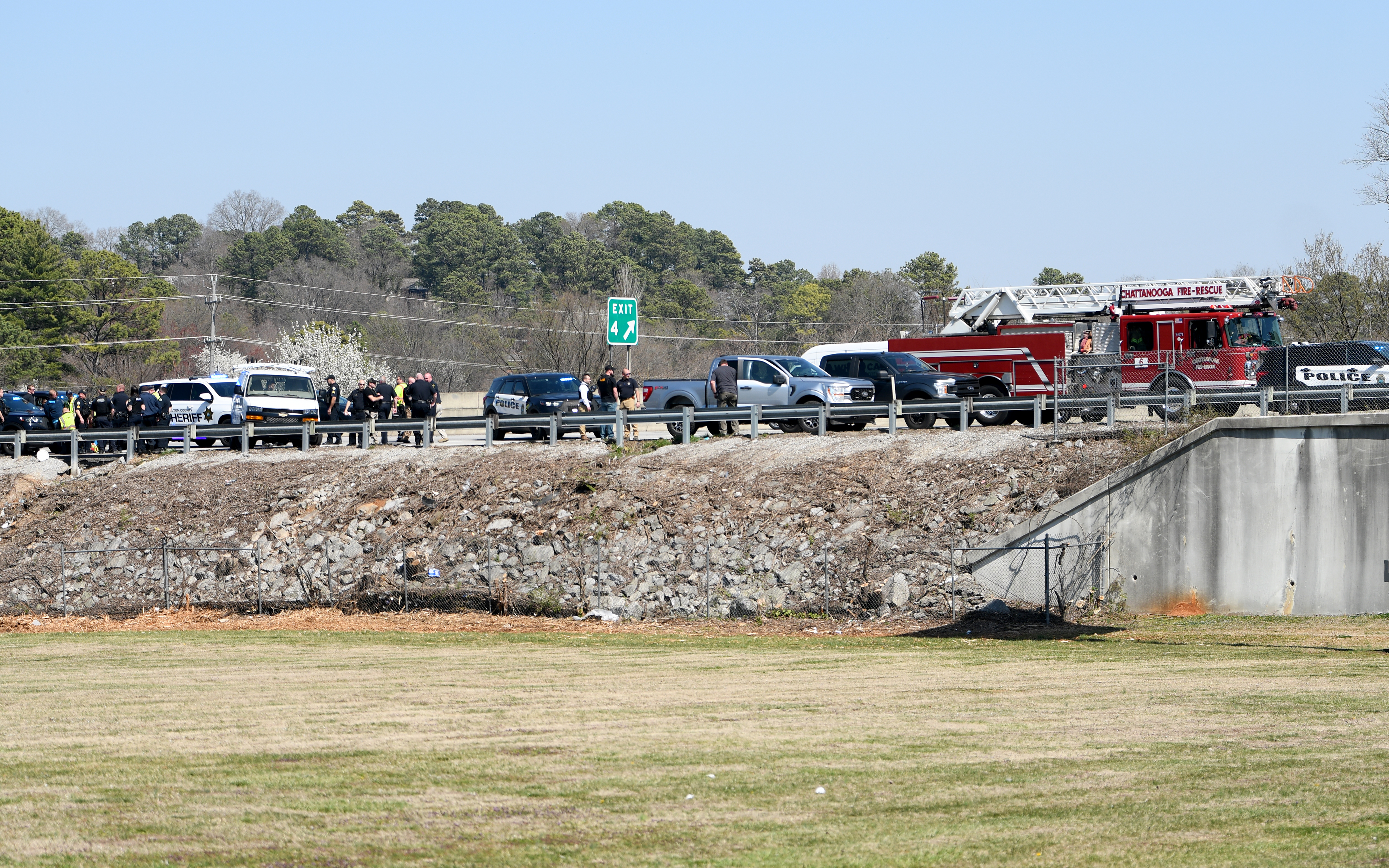 Staff photo by Abby White / Chattanooga police and fire department surround the scene after a pursuit on Highway 153 following a stolen EPB van March 12, 2025.