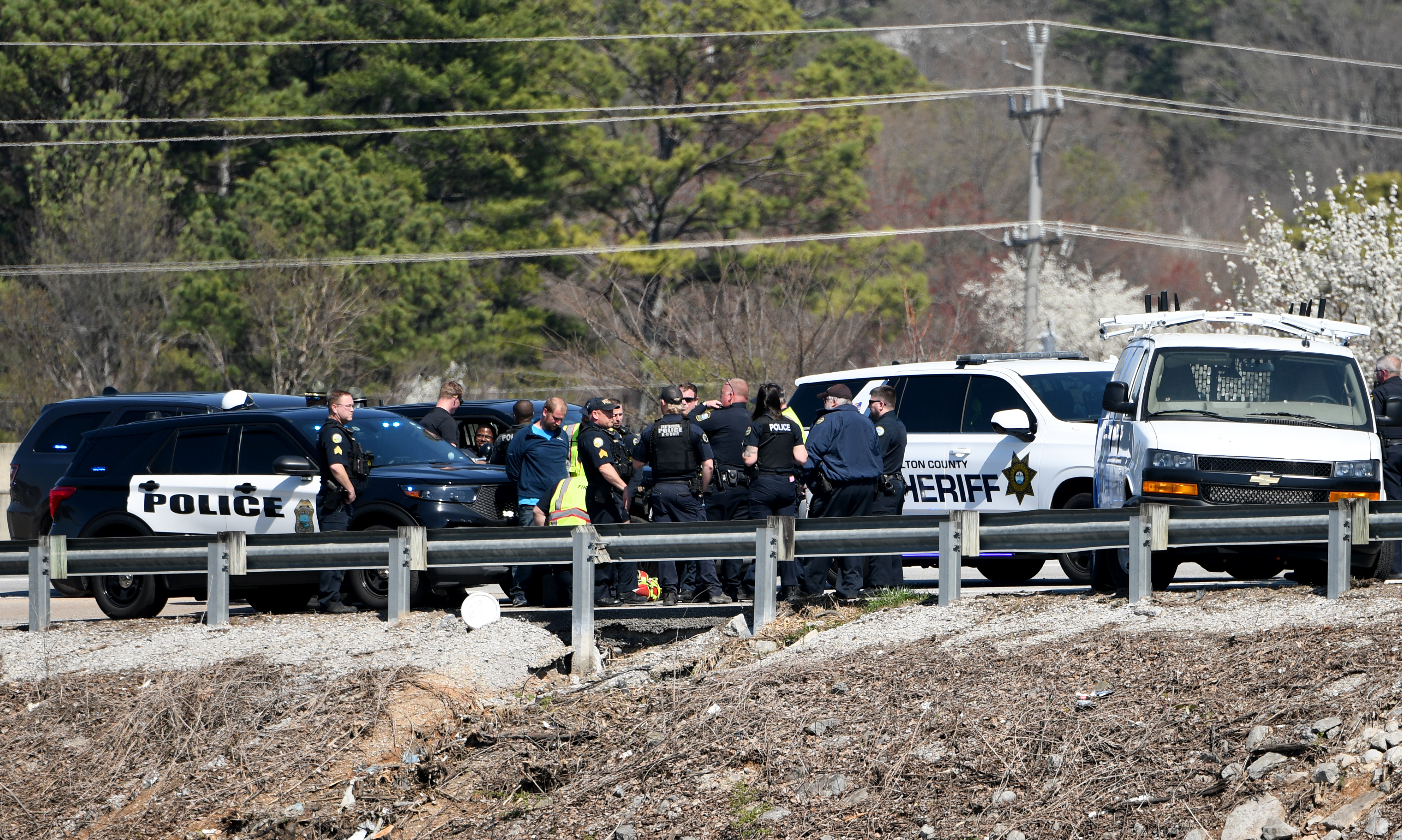 Staff photo by Abby White / Chattanooga police and fire department surround the scene after a pursuit on Highway 153 following a stolen EPB van March 12, 2025.