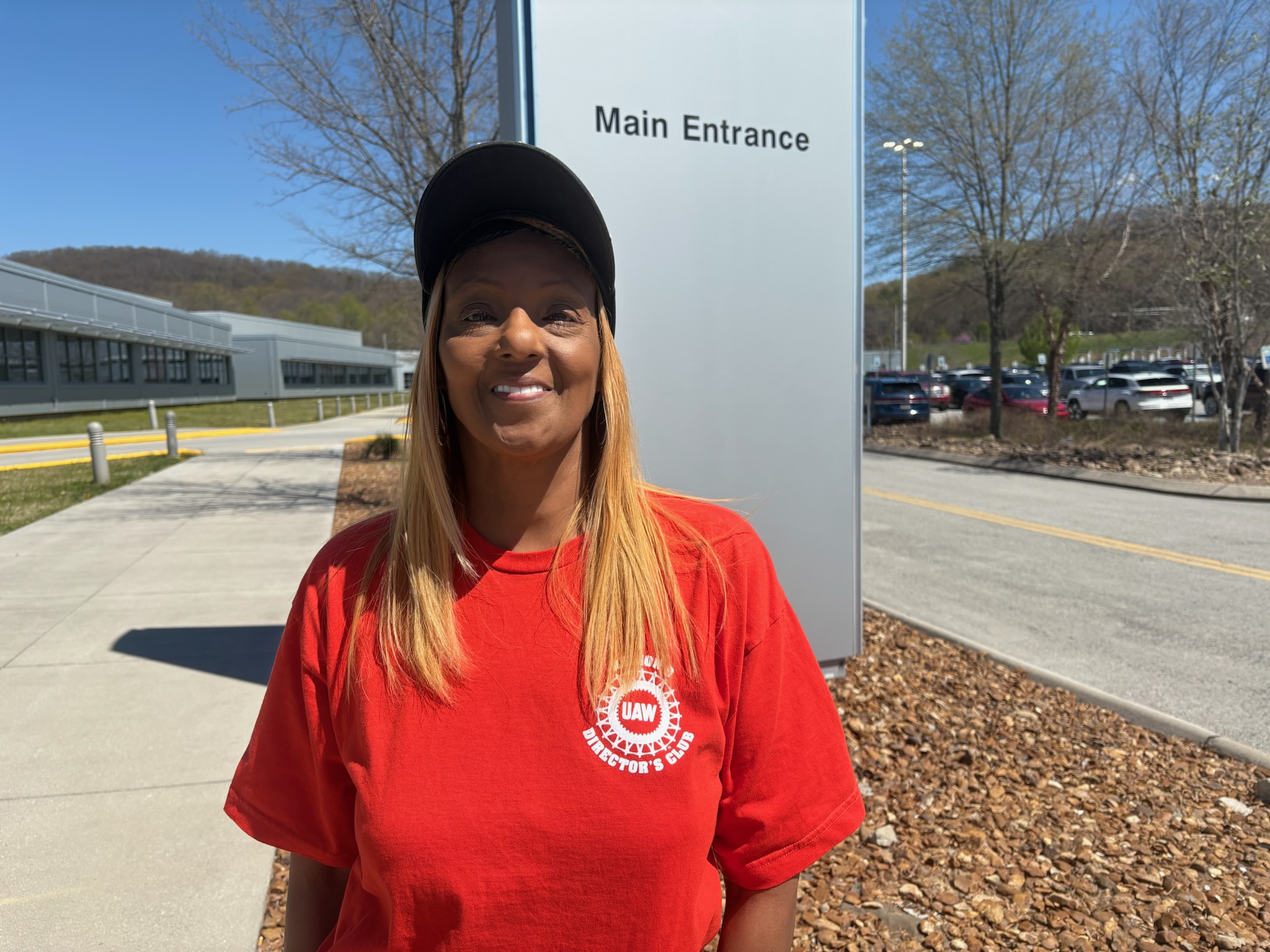 Staff photo by David Floyd / UAW member Letonja Berry, who has worked for Volkswagen for about 15 years, stands outside the company's offices during a rally March 26, 2025.