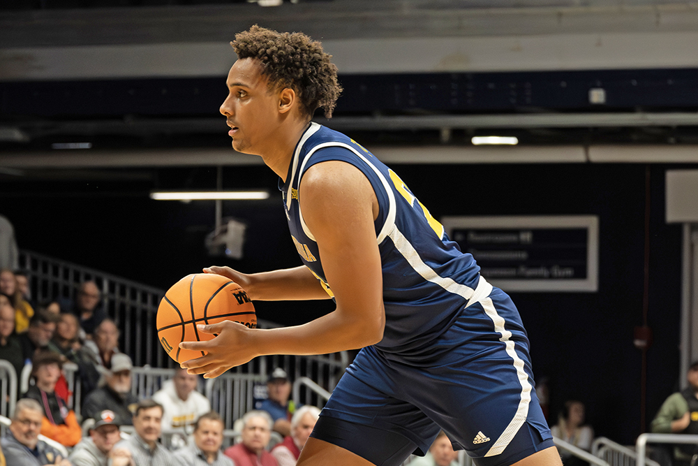 UTC Echo Photo/Emma Sutherland UTC freshman post player Latif Diouf looks to pass in the Mocs' 80-73 win over Loyola Chicago in a semifinal of the NIT on Tuesday, April 1, 2025, at Hinkle Fieldhouse in Indianapolis.