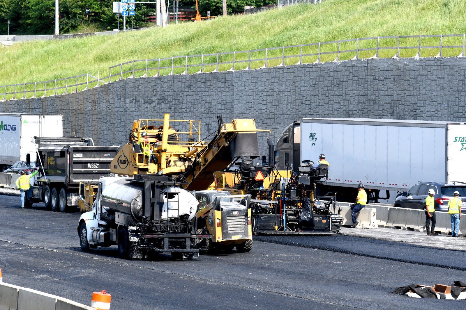 Staff Photo by Robin Rudd / Workers resurface the new westbound lanes of Interstate 24 on April 21, 2025. The week of April 21-25 is Work Zone Awareness Week in Tennessee. Drivers are reminded to watch for work zone speed limits and move over or slow down when encountering emergency or utility vehicles on the roadside.