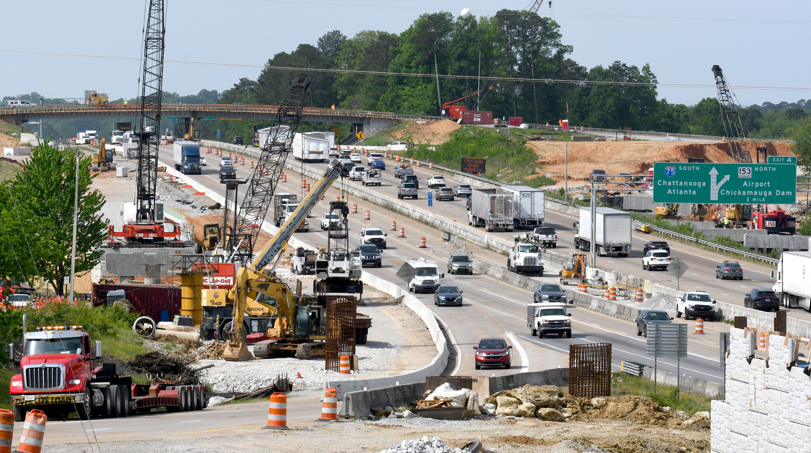 Staff Photo by Robin Rudd / Work continues April 20, 2025, on Interstate 75 near Hamilton Place. The week of April 21-25 is Work Zone Awareness Week in Tennessee. Drivers are reminded to watch for work zone speed limits and move over or slow down when encountering emergency or utility vehicles on the roadside.