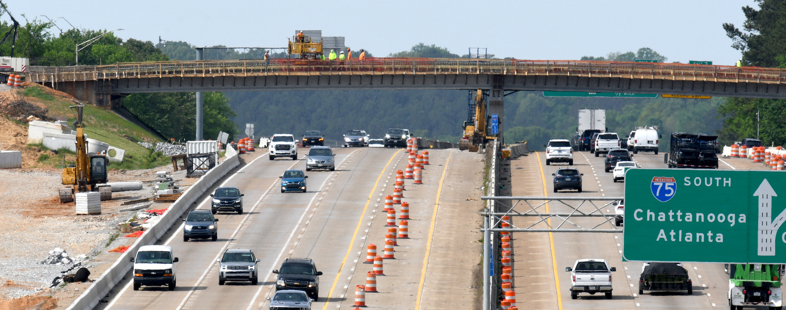 Staff Photo by Robin Rudd / Work continues April 20, 2025, on Interstate 75 near Hamilton Place. The week of April 21-25 is Work Zone Awareness Week in Tennessee. Drivers are reminded to watch for work zone speed limits and move over or slow down when encountering emergency or utility vehicles on the roadside.