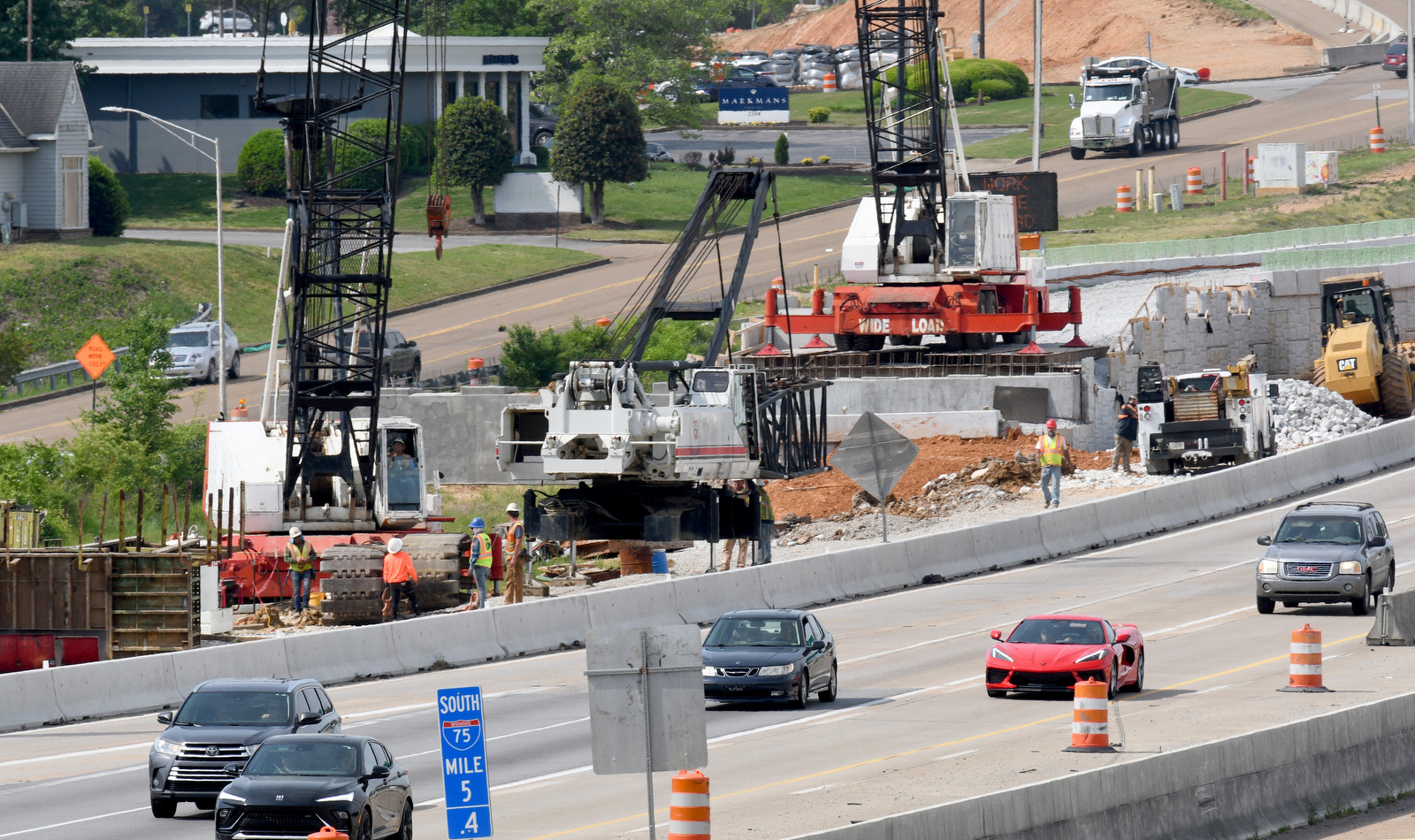 Staff Photo by Robin Rudd / Work continues on I-75 near Hamilton Place. The week of April 21-25 is Work Zone Awareness Week in Tennessee, when drivers are reminded to watch for work zone speed limits and move over or slow down when encountering emergency or utility vehicles on the roadside.