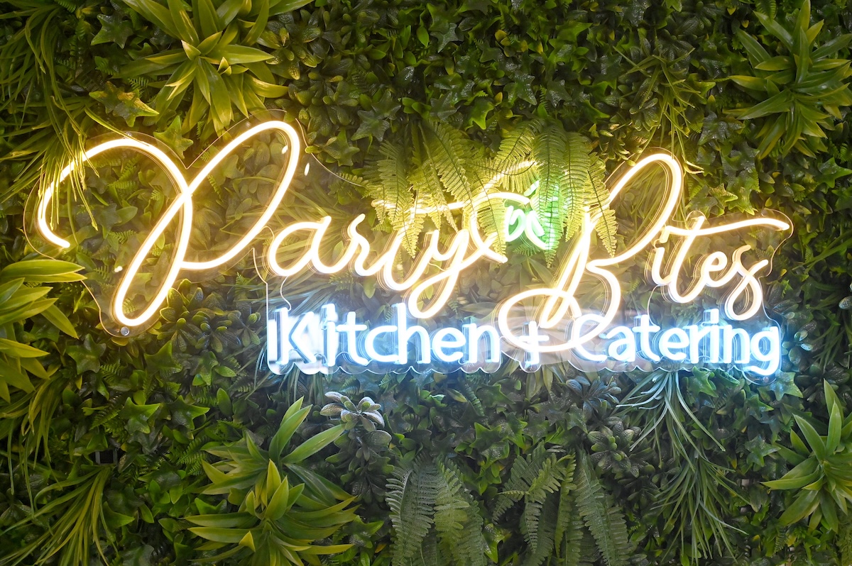 Staff photo by Abby White / The Party Bites Kitchen & Catering logo.