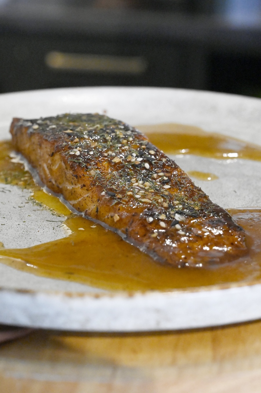 Staff photo by Abby White / Party Bites chef Antonio Tate's salmon fillet is finished with his signature chai bourbon glaze.