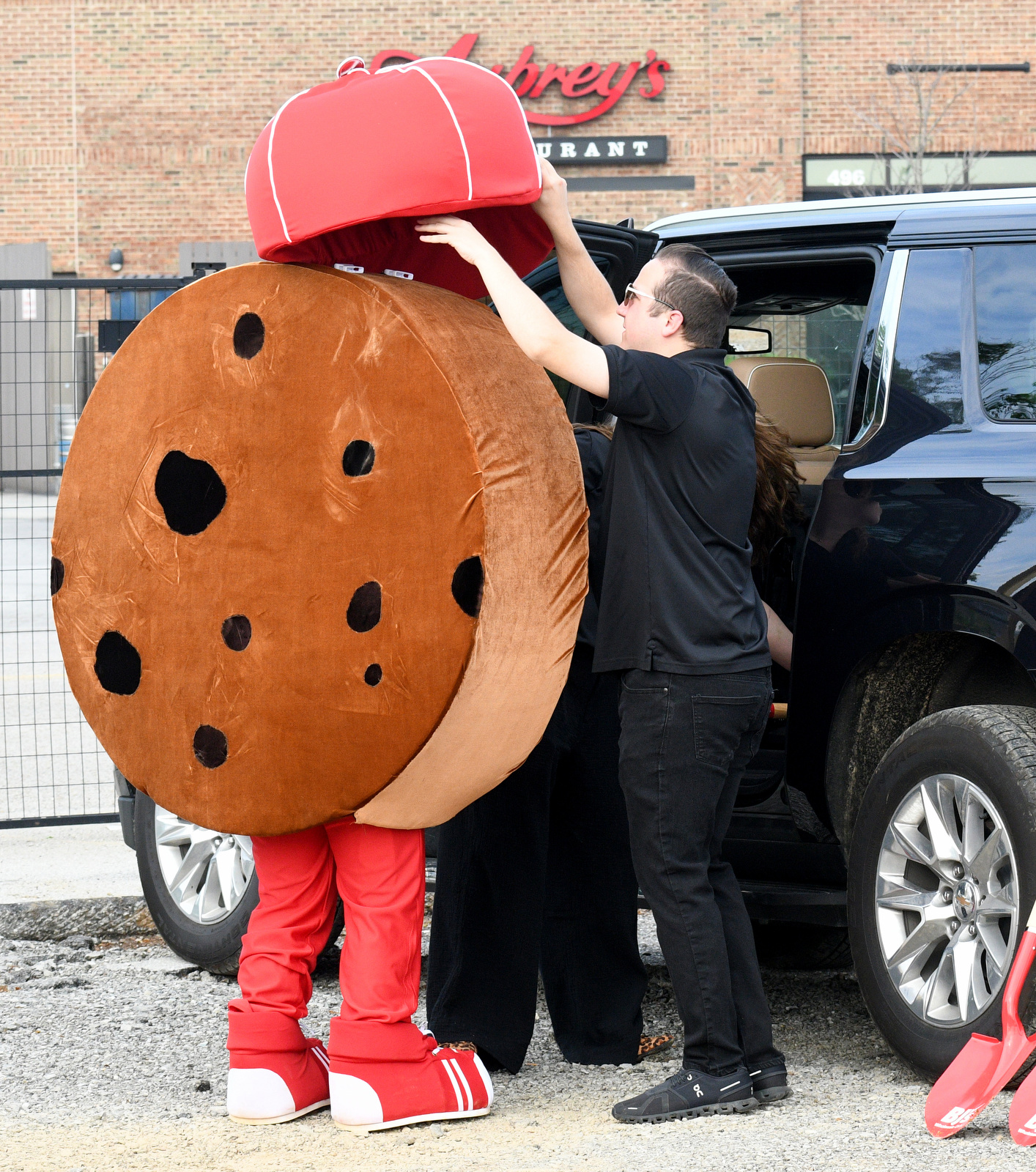 Staff Photo by Robin Rudd / The BJ's Wholesale staff dresses Chunky, the business's mascot, prior to the groundbreaking. BJ's Wholesale Club broke ground April 30, 2025, for its new location in Chattanooga at the former Sears at Northgate Mall.