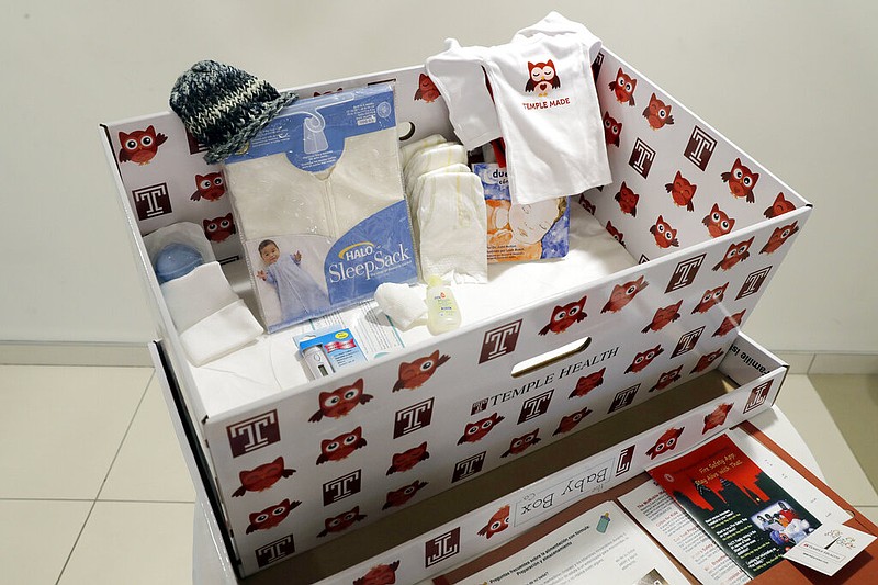 Displayed in 2016 is a baby box at Temple University Hospital in Philadelphia. The boxes are functioning bassinets complete with a sheet and mattress and are designed to help reduce infant mortality. (AP Photo/Matt Rourke)