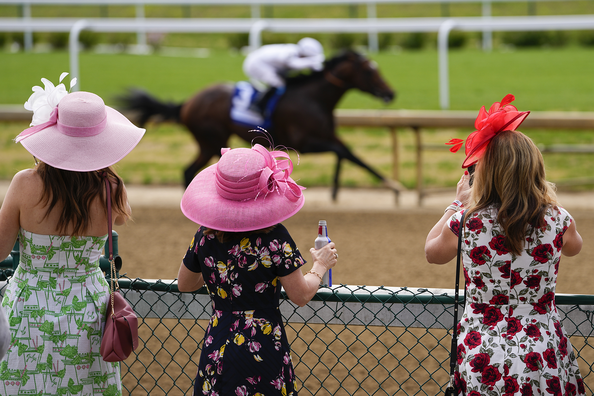 AP photo by Julio Cortez / Fans watch the first undercard race ahead of the 149th Kentucky Derby at Louisville's Churchill Downs on May 6, 2023. NBC Sports is producing 12 1/2 hours of coverage this weekend from Churchill Downs related to Friday's Kentucky Oaks and Saturday's Kentucky Derby.