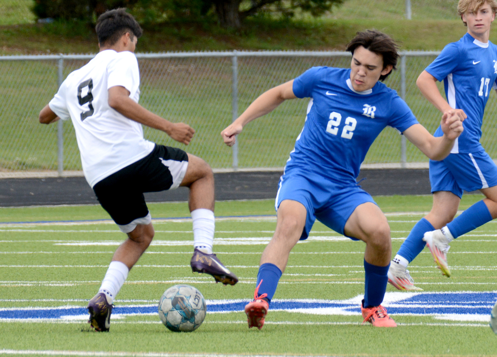 Staff Photo by Robin Rudd / Ringgold's Michael Gray (22) challengers a Shaw player. Ringgold hosted Shaw in the GHSA boys state soccer tournament on May 5, 2025.