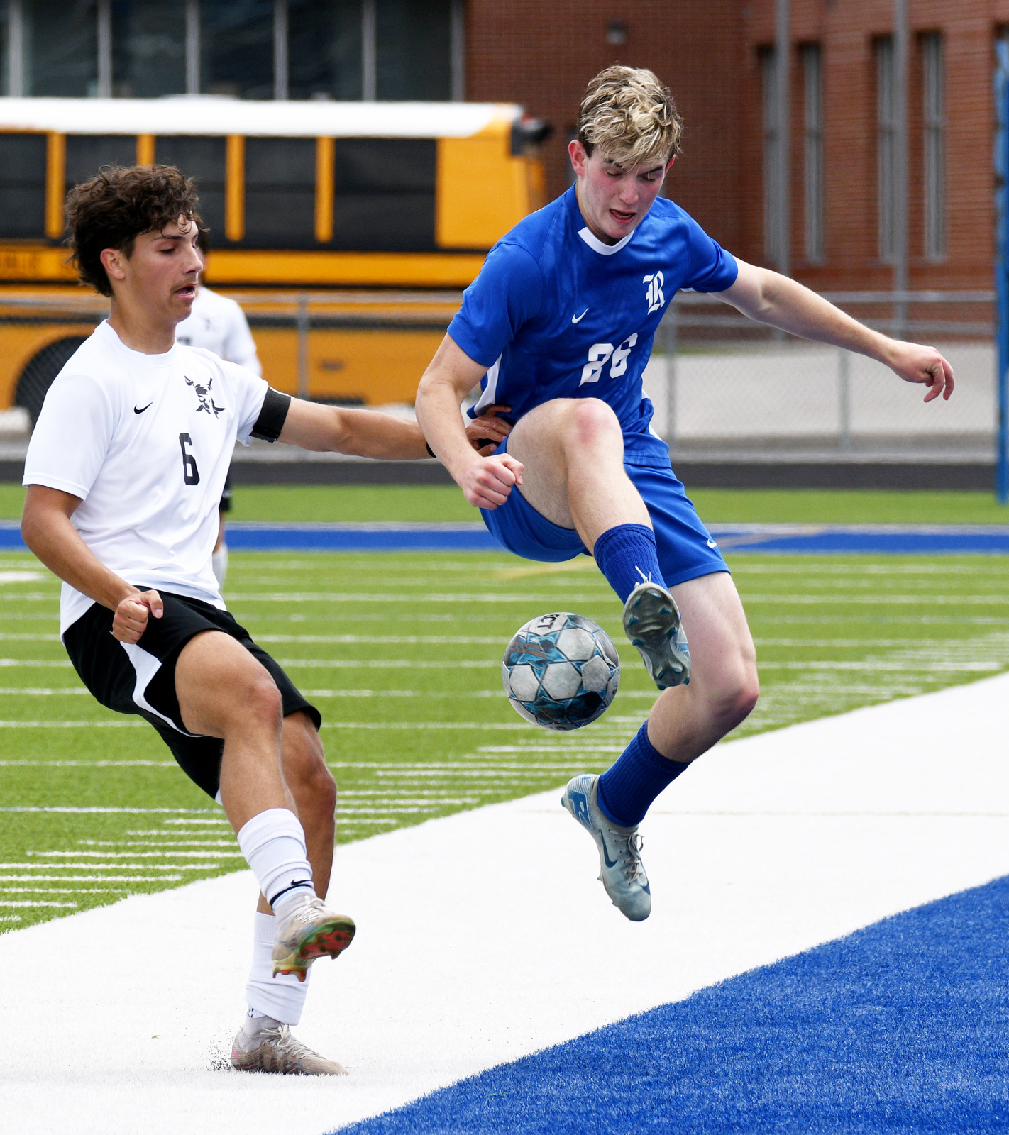 Staff Photo by Robin Rudd / Ringgold's Michael Gray (22) kicks the ball backwards to keep it in play. Ringgold hosted Shaw in the GHSA boys state soccer tournament on May 5, 2025.